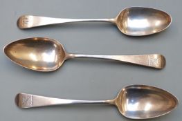 Three Georgian hallmarked silver dessert spoons comprising a bottom marked example and a pair London