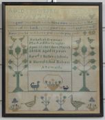 Framed cross stitch sampler dated 1851 by Rebekah Bremner, 32 x 28cm