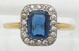 An 18ct gold ring set with paste surrounded by diamonds, size I/J