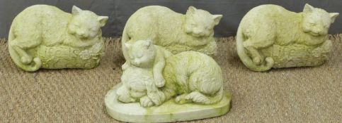Three garden models of cats, length 28cm and another of a cat and dog sleeping