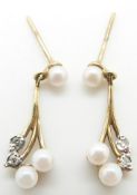 A pair of 9ct gold earrings set with pearls and diamonds