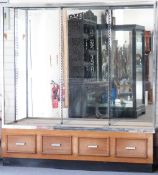 Art Deco style oak and chrome display or haberdashery display cabinet with mirror back and four