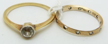 A 9ct gold ring and another yellow metal ring, 2.6g