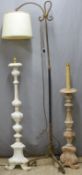 Two carved wood standard lamps and one metal example