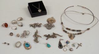 Four silver rings, silver horse brooch, silver earrings, silver heart locket, etc