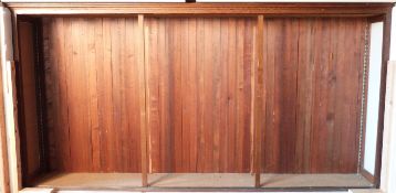 Large oak display or haberdashery shop cabinet with panelled back, L361 x D48 x H187cm