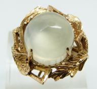 A 9ct gold ring set with a large moonstone cabochon (size R)