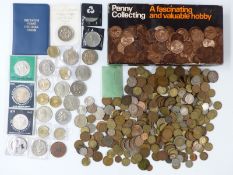 A collection of UK pennies in a hobby box, includes modern crowns, seven single metal £2 coins