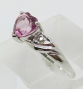 A 9ct gold white gold ring set with heart cut pink topaz and diamonds (size P)