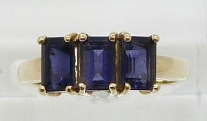 A 9ct gold ring set with three iolite (size N)