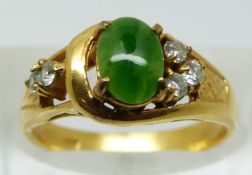 A yellow metal ring marked 18k set with faux jade and paste, 2.3g (size L)