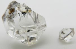 A loose uncut rock crystal and a smaller example, 6.5g