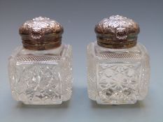 A pair of Edward VII hallmarked silver mounted cut glass inkwells, Sheffield 1902 maker Atkin