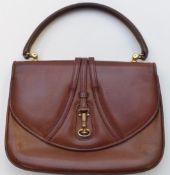 A vintage Gucci brown leather handbag