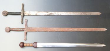 Two Exacalibur swords each 112cm long together with one other with wooden pommelled handle