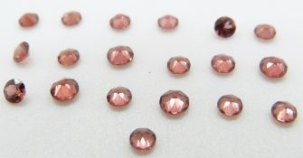 Nineteen round cut garnets, 0.52g