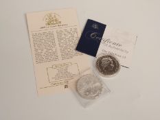 2009 1oz silver Britannia together with a 2010 silver Liberty dollar, with certificates