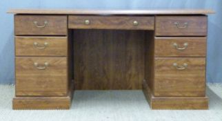 Twin pedestal desk having three drawers to each side and central drawer above the knee hole, W150