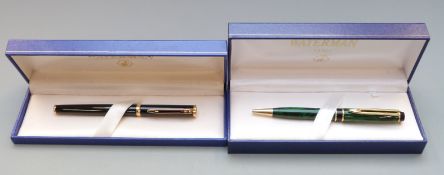 Boxed Waterman ballpoint pen with black shaft and gold plated fittings together with a similarly
