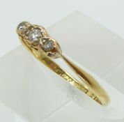 An 18ct gold ring set with diamonds in a platinum setting (size L)