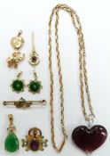 A 9ct gold necklace (5.2g), 9ct gold heart locket, 9ct gold elephant charm (1.9g), two jadeite style