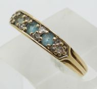 A 9ct gold ring set with topaz and diamonds (size P)
