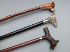 Three walking canes with novelty dogs head handles