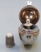 Silver plated egg shaped sewing etui by Thornhill 144 Bond St. containing a hallmarked silver