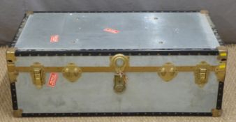 A metal bound and riveted flight case/trunk, H35 x W100 x D50cm