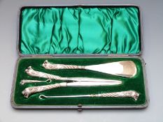 Cased late Victorian/ Edwardian hallmarked silver and steel dressing set with wrythen moulded