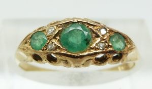 A 15ct gold ring set with emeralds and diamonds (size L)