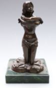 Ellis bronze of a semi nude kneeling lady removing her top, height 24cm