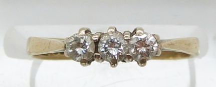 A 9ct gold ring set with three diamonds (size I)