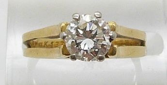 An 18ct ring set with a round cut diamond of approximately 0.9ct in a platinum setting, bought in