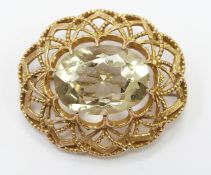 A 9ct gold brooch set with a large oval quartz, 12.3g, diameter approximately 3.5cm