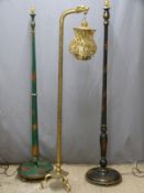 Two oriental lacquered standard lamps and a brass candle holder with dragon decoration