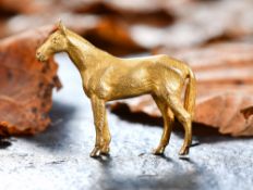 A 9ct gold brooch in the form of a horse, 12.1g