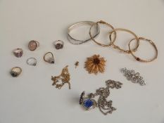 A collection of jewellery, brooches including Sarah Coventry, bangles, silver rings etc