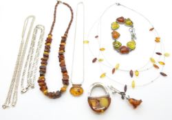 A beaded amber necklace, silver bracelet set with pressed amber, silver and amber necklace,