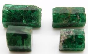Four uncut loose hexagonal emeralds, 2.55g, 2g, 0.94g and 1.51g