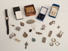A collection of silver jewellery including earrings, two ingots, watch, two fobs, filigree brooch,