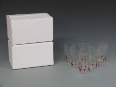 Twelve Giampolo Nason Murano drinking glasses with red decoration, in original boxes