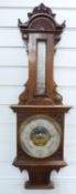 Late 19thC / early 20thC wall aneroid barometer / thermometer combination in carved wooden case,