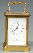 Mathew Norman Swiss made 20thC brass cased carriage clock with corniche style case, white