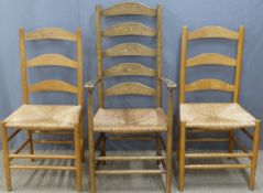 Three Arts & Crafts ladderback chairs comprising a carver and a pair