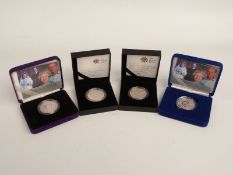 Four cased silver proof £5 coins including two 2007 Diamond Wedding, 2010 Restoration of the