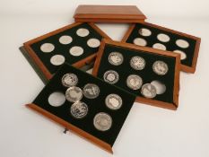 Twenty-four crown sized coins including, Falklands, Fiji, Malawi, Central America and Indonesia,