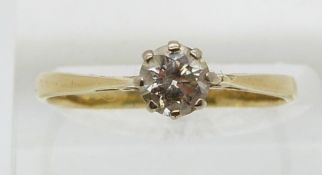 An 18ct gold ring set with a diamond of approximately 0.55ct in a platinum setting (size P)