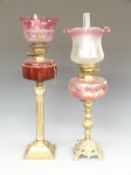 Two Victorian oil lamps converted to electricity with cranberry type glass bowls and etched glass