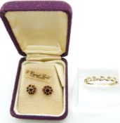 A pair of 9ct gold earrings set with garnets and a 9ct gold ring